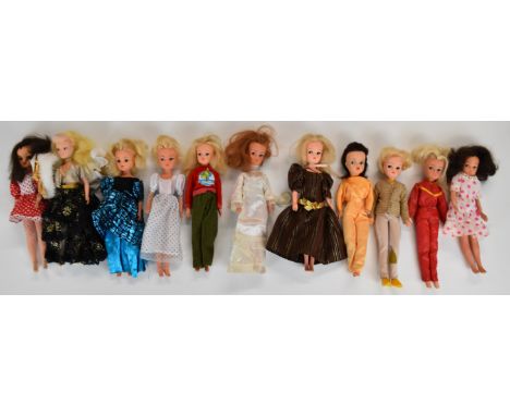 Eleven vintage Pedigree Sindy dolls wearing 1970'/80's outfits.