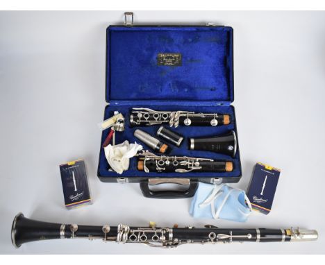 Two woodwind Bb clarinets comprising Besson of London 292886 and Buffet Crampon Paris 1187611, together with two boxes of ree
