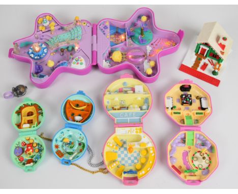 Six Bluebird Toys Polly Pocket playsets together with nine figures and ring, 1990-93.