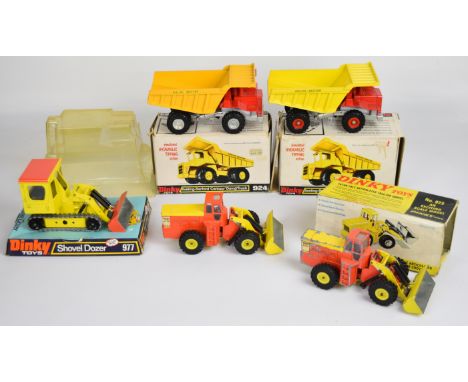 Five vintage Dinky Toys diecast model construction vehicles comprising Shovel Dozer 977, Eaton Yale Articulated Tractor Shove