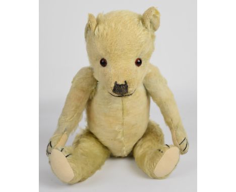 A vintage Teddy bear with golden mohair, disc joints and stitched features, circa 1930's/40's, height 46cm