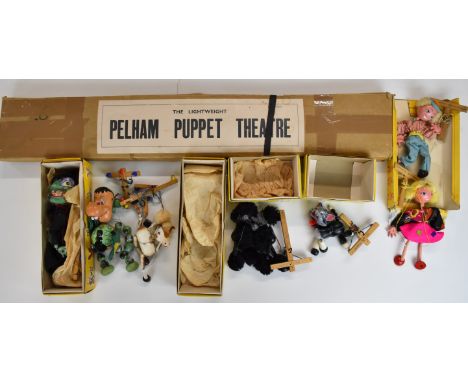 Seven Pelham Puppets to include Wicked Witch and Baby Dragon, together with a Pelham Lightweight Puppet Theatre, some in orig