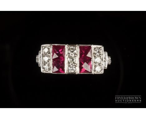 An attractive Art Deco style ruby and diamond dress ring, the top set with two bands of two Swiss cut rubies with brilliant c