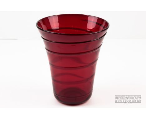 James Powell & Sons for Whitefriars, a ruby glass conical vase, ribbon trailed, unmarked, 18cm diameter and 21cm high approx.