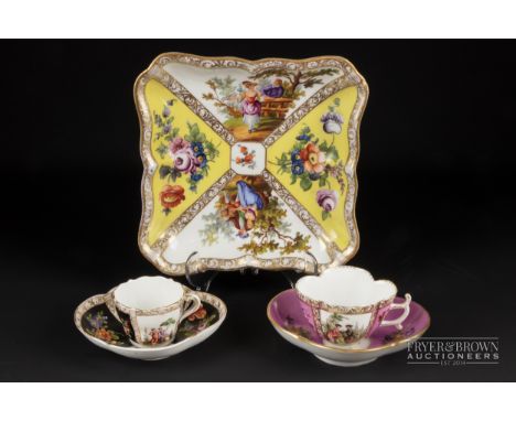 A group of Dresden porcelain, comprising two cups & saucers and a dessert dish, quartered in rose pink, black & yellow (5)