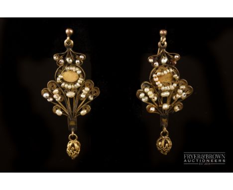 A pair of antique seed pearl and gold filigree pendant earrings, in antique case