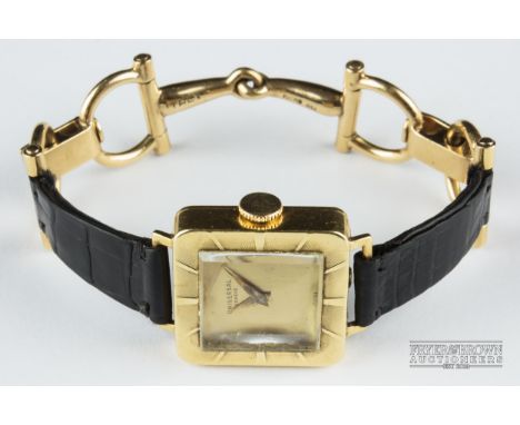 A vintage Gucci/Universal 18ct yellow gold wristwatch, c1965, the square dial with engine turned outer bezel on a leather and