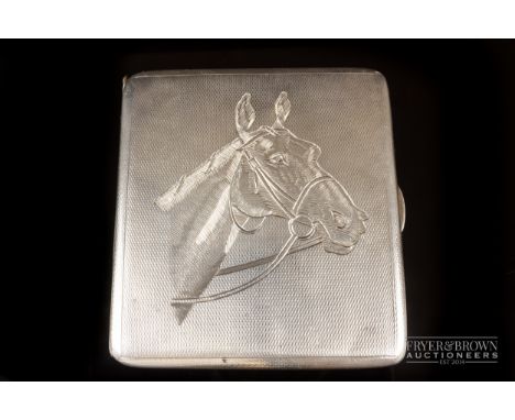 Equestrian interest - a silver cigarette case engraved with a horse's head on an engine turned ground, makers mark for James 