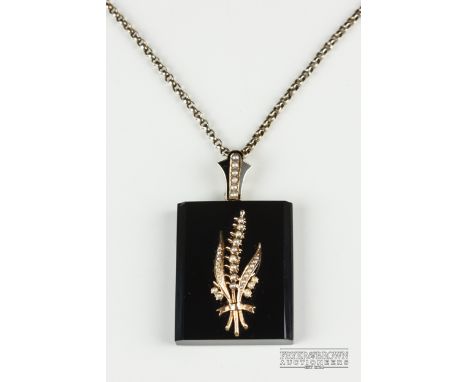 An antique split pearl, gold and onyx locket pendant on a gold chain, c1870, the rectangular bevelled edge onyx pendant with 