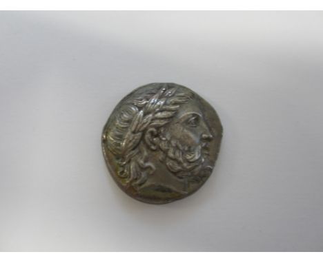 Philip II,Ar tetradrachm, 14.16g. Obv. Laureate head of Zeus r., R.Naked youth on horse pacing r holding long palm branch, wr
