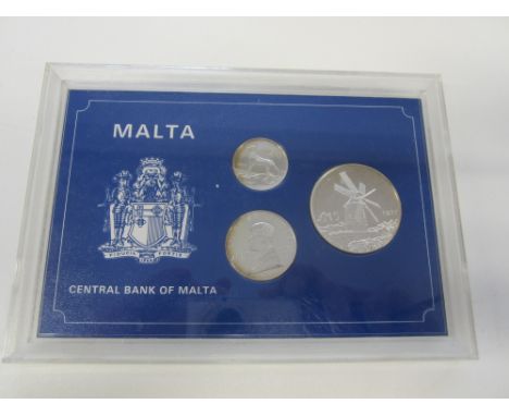 Malta,Proof Set 1977, comprising silver 5-Pounds, 2-Pounds, 1-Pound, in Bank of Malta plastic case of issue (KM PS5).  Almost