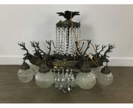 BRASS COMPOSITION EIGHT-LIGHT CHANDELIER, MID 20TH CENTURY suspended with a series of prismatic drops, each fitting with stag