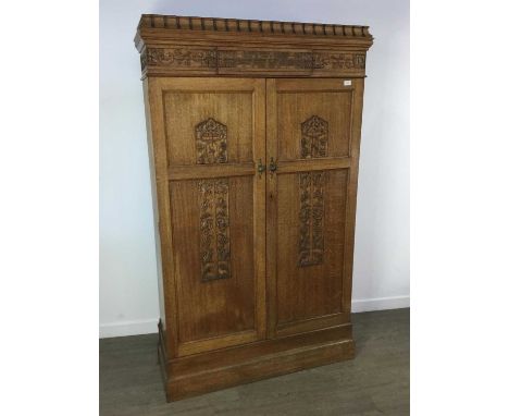 OAK ECCLESIASTICAL CUPBOARD, CIRCA 1939 with fluted caddy top over a moulded frieze inscribed Blackfriers Church gifted by Mi