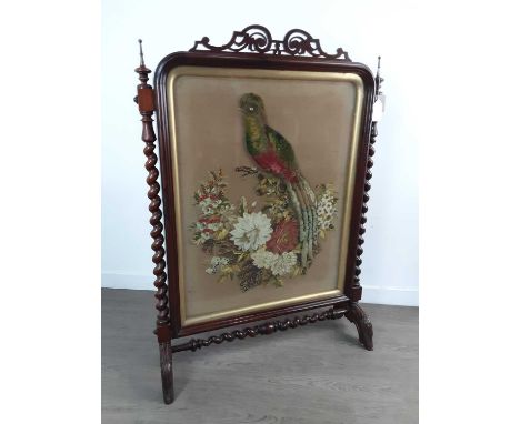 VICTORIAN ROSEWOOD FIRESCREEN, MID 19TH CENTURY inset with a stump and needlework panel depicting a perched bird of paradise 