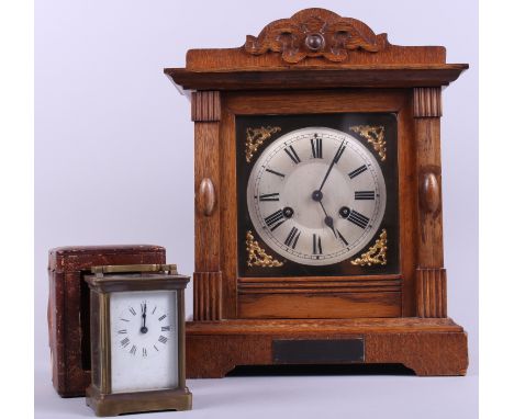An early 20th century brass cased carriage clock, in leather travel case, and an oak cased bracket clock with silvered dial a