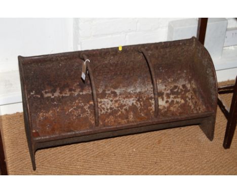 A cast iron feeding trough, 30 1/2" wide