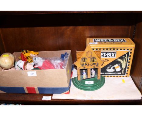 A quantity of dolls and toys, a reproduction" Weet-bix" tin, a "Chad Valley" barometer and a "Standard" fireworks poster
