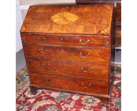 A George III mahogany and yew bureau with fan patterae decoration, four graduated drawers, on bracket supports, 42" wide