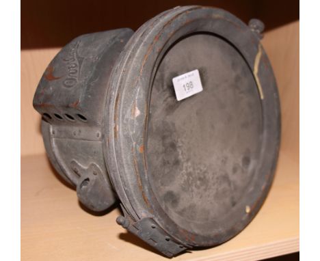 An overland car headlamp (damaged reflector)