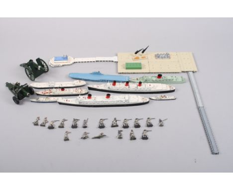 A Tri-ang waterline model of Queen Mary, Queen Elizabeth, Britannia, a number of other ships, pier, harbour, two Britain's fi