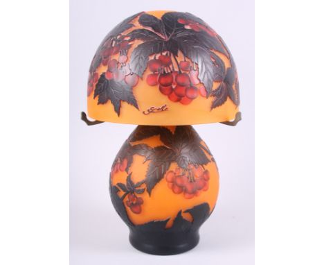 A "Galle" style frosted glass table lamp, with overlaid etched decoration of cherry sprigs, in shades of red and orange, 13" 