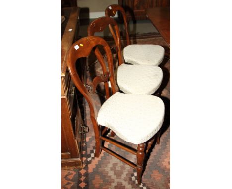A set of six 19th century loopback dining chairs with stuffed over seats, on bobbin turned supports