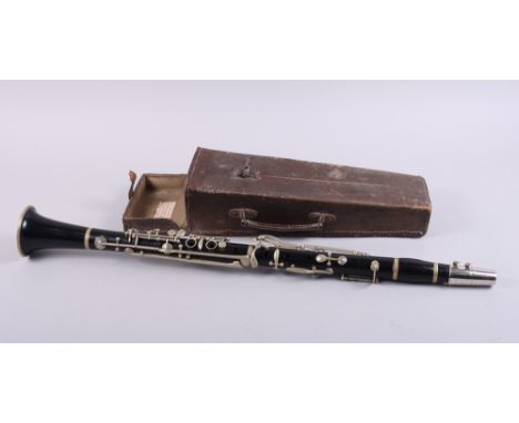 A hardwood clarinet, in leather case, 26 1/2" long, and an Honourable Artillery Company swagger stick