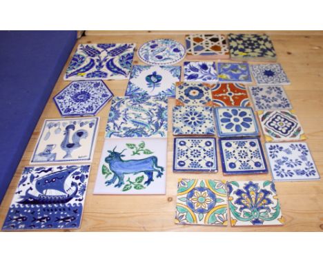 Four delftware tiles, a larger similar tile and a number of other tiles