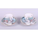 A pair of Herend "Cornucopia" pattern cabinet cups and saucers, hand-painted "Altai Saudonie" to