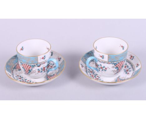 A pair of Herend "Cornucopia" pattern cabinet cups and saucers, hand-painted "Altai Saudonie" to base, with blue, red and gil