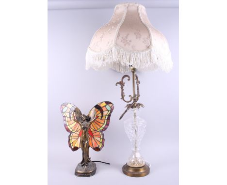 A "Tiffany" style table lamp, in the form of a fairy dancing, the wings formed from multi-coloured stained glass panels, 16" 