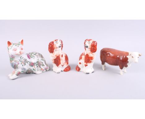 A Beswick model of a champion bull, a pair of Staffordshire spaniels and a Chinese porcelain famille vert cat