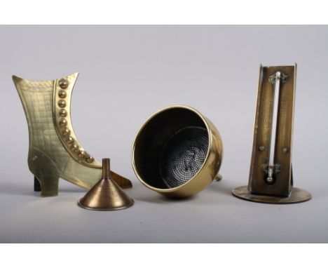 A 19th century brass oven thermometer, two brass funnels and a 19th century brass model of a high buttoned boot