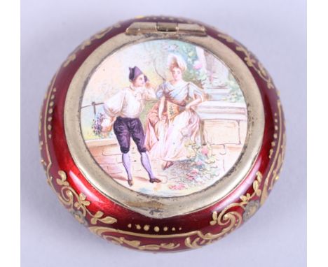 A late 19th century Continental gilt metal circular cushion-shaped pill box, the body decorated in red enamel with gilt highl