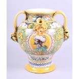 A mid 20th century Majolica two-handled wet drug jar with yellow and green glaze