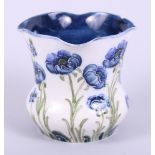 A Moorcroft Florian Ware vase, decorated flowers, with green signature to base, 3 1/2" high (chip