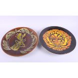 A Poole Pottery Ionian charger, by Jane Brewer, decorated stag, and another Poole Pottery Aegean