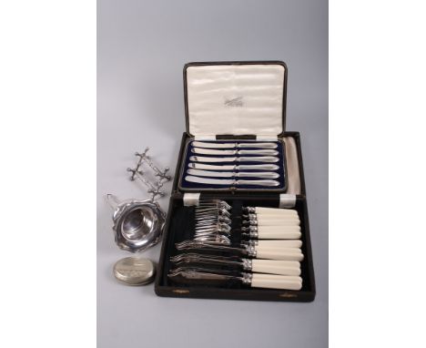 A silver plated wine funnel, two knife rests, a snuff box, a cased set of fish knives and forks and a cased set of butter kni