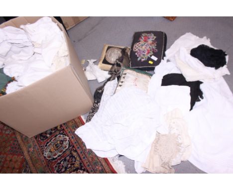 A quantity of linen and mixed textiles, including christening gowns, cushions, lace and other items