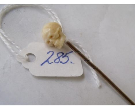Carved skull stick pin       