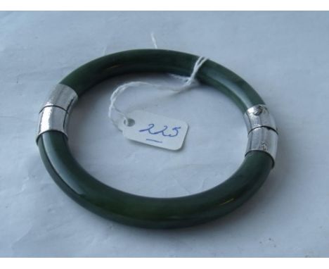 Silver mounted green stone bangle     