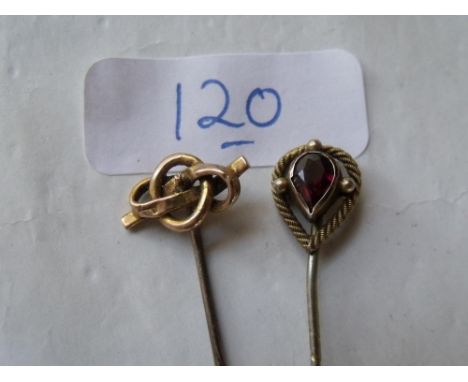 Two gold mounted stick pins      