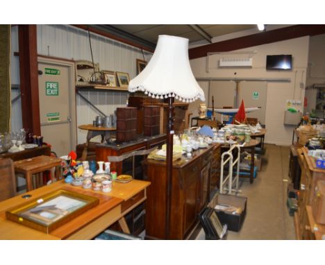A mahogany standard lamp and shade 