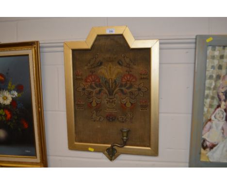 A 19th Century wool tapestry with single brass candle sconce 