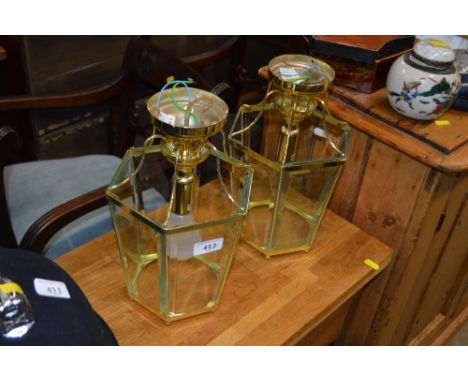 Two brass light fittings (one lacking one glass)