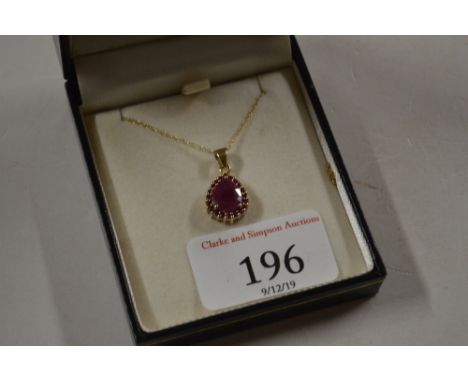 A 9ct gold mounted ruby coloured pendant necklace