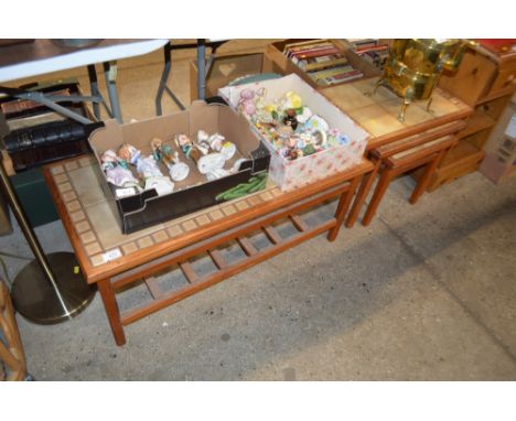 A teak and tile top coffee table; and a nest of three matching occasional tables 