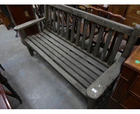 A Slatted hardwood garden bench. 