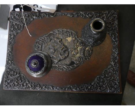 An early 20th century leather stationary folder applied with silver embellishments along with a conforming tapering silver in