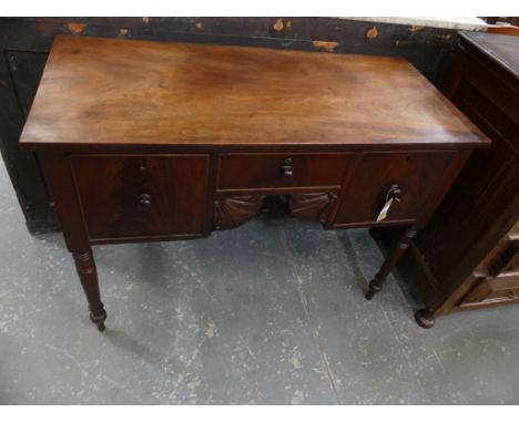 A Mid 19th Century mahogany sideboardThe rectangular top above an arrangement of three drawers and a pair of carved spandrels